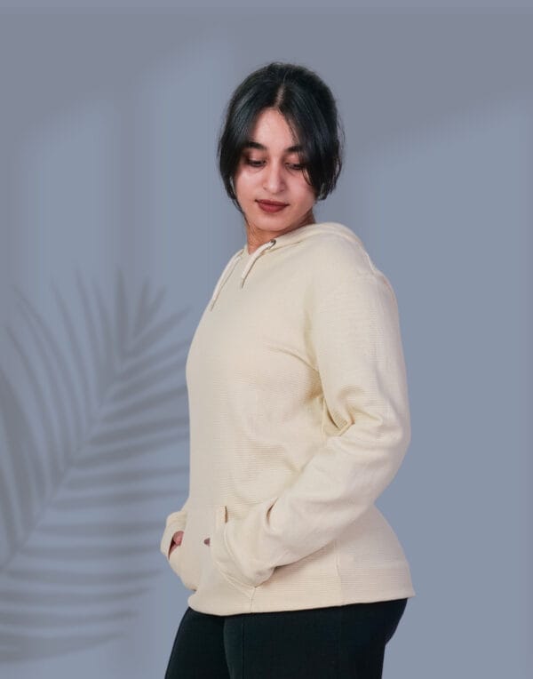 a woman in a white sweater