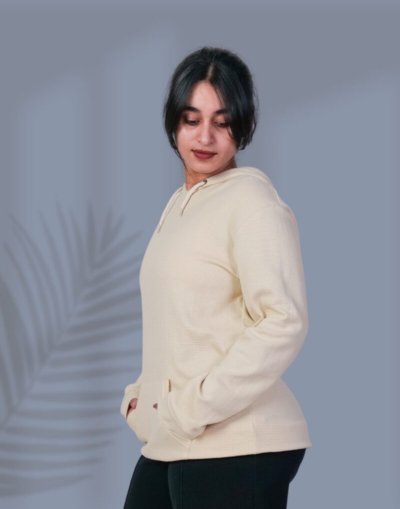 a woman in a white sweater
