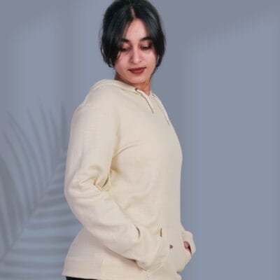 a woman in a white sweater