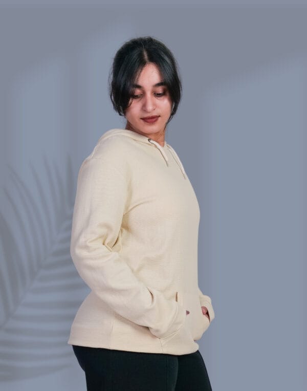 a woman in a white sweater